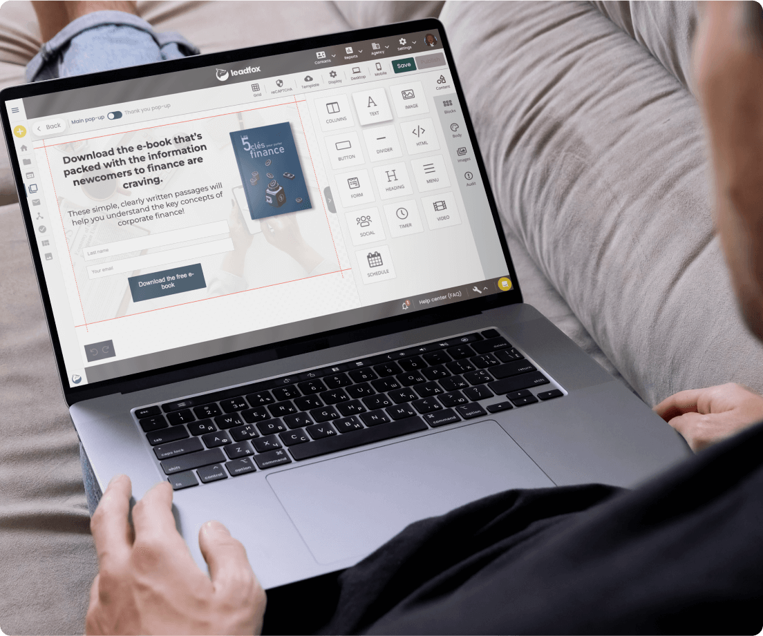 Laptop showing the Leadfox pop-up editor with a free e-book pop-up